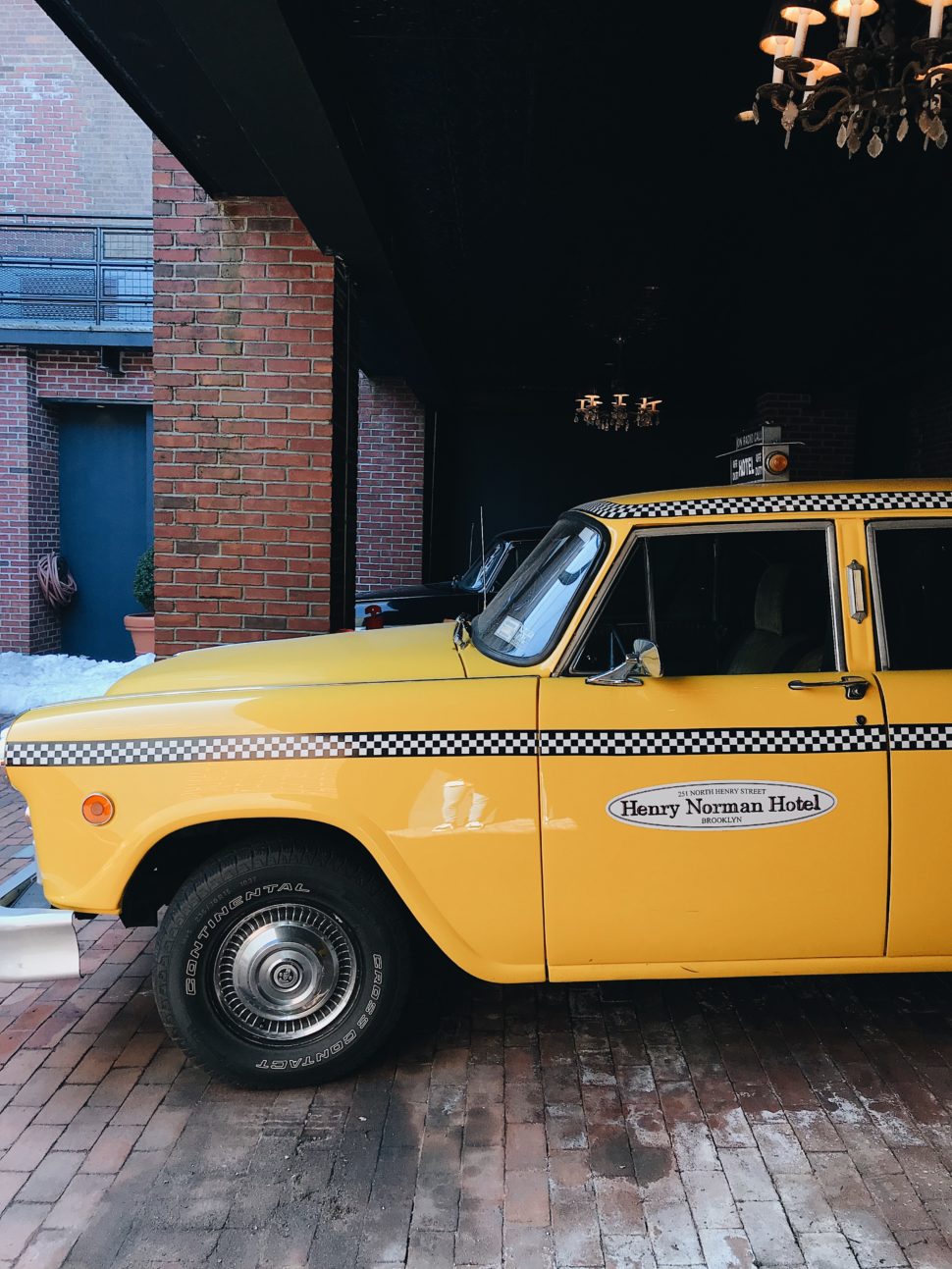 Henry Norman Hotel signature vintage yellow cab.